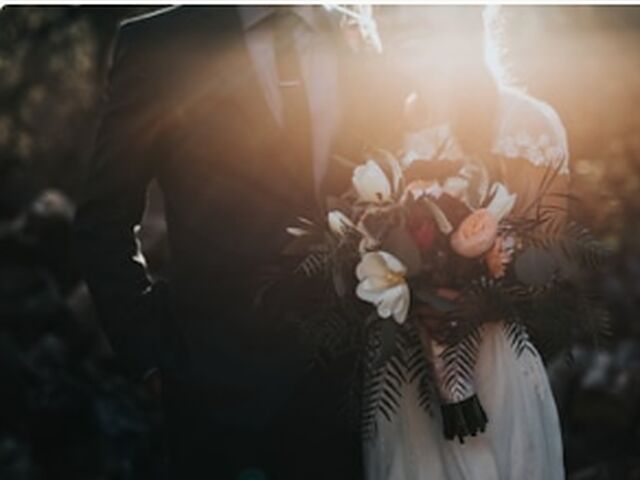 Couple with the bouquet backlit